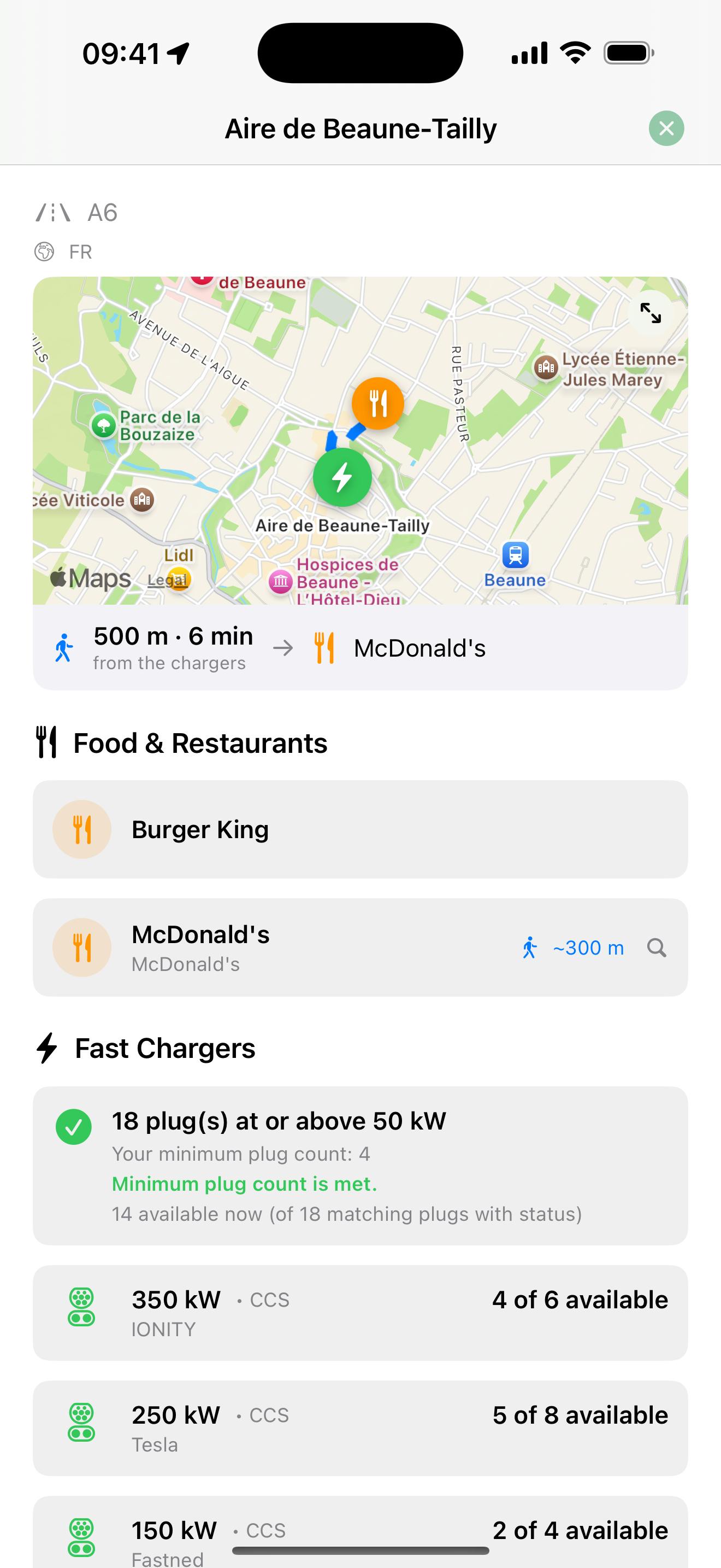 A charging stop showing chargers, power, availability, restrooms, and nearby food